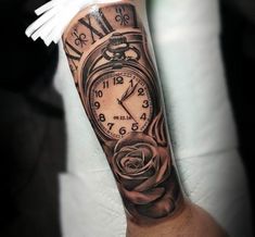 a man's arm with a clock and rose tattoo on it