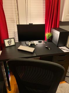 a computer desk with a keyboard, mouse and monitor sitting on it's side