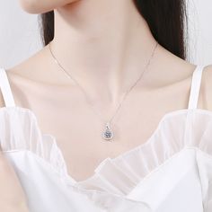 This Water Drop Heart Moissanite Necklace Pendant brings sparkle and elegance to any outfit. Crafted with sterling silver and a genuine Moissanite gemstone, this pendant has a radiant cut stone that is sure to turn heads. The perfect accessory for any occasion. Product Details: Material: 925 Sterling Silver Stone: Moissanite Diamonds/D /1 carat Weight: 2.54g Length: 45cm Pendant Diamond Height: 6.5mm SKU: AN23102304 Keywords: moissanite chain, moissanite necklace, moissanite pendant, moissanite Silver Solitaire Diamond Cut Oval Pendant Necklace, Silver Cubic Zirconia Crystal Necklace As Gift, Silver Cubic Zirconia Crystal Necklace For Gift, Silver Solitaire Flower Pendant Necklace For Anniversary, Silver Solitaire Necklace With Brilliant Cut Oval Pendant, Elegant Silver Gemstone Crystal Necklace, Elegant Silver Crystal Necklace With Gemstone, Elegant Silver Crystal Gemstone Necklace, Silver Solitaire Necklace With Flower Pendant