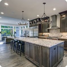 a large kitchen with an island and lots of counter space