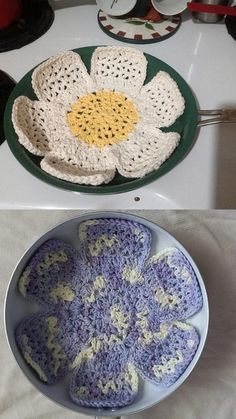 two crocheted dishes are sitting on a table next to each other and one has a flower in the center