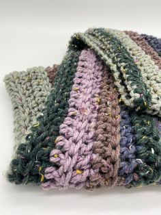 "This is a handmade crochet multicolored infinity scarf. Perfect for any winter/fall occasion. This scarf is super stretchy, soft, and breathable. The soft cool colors and flecks of yellow, pink, and white make for a beautiful subtle pop of color in a winter outfit. Materials: 77% Acrylic, 20% wool, 3% other fiber Size: 80\" long, 8\" wide Colors: Dark blue, grey, dark purple, medium purple/pink" Cozy Crochet Yarn Infinity Scarf, Winter Head Wrap, Goth Spider, Multicolor Crochet, Crochet Lovey, Dark Blue Grey, Cool Colors, Medium Purple, Crochet Handmade