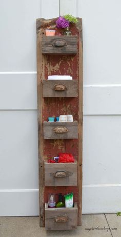 an old wooden shelf with drawers on it