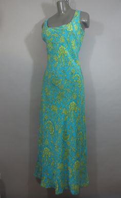 JANE SEYMOUR Silk Maxi Dress, Sleeveless, Turquoise w Lime Floral, Fully Lined, Bias Cut Shell and Lining,  Very Good Condition. Tag says 8MS. Measurements: Measurements can vary as both shell and lining are cut on the bias. 14" across top of shoulders 38" bust 32-24" waist 40" hips 53-54" long Sleeveless Turquoise Dress For Vacation, Turquoise Sleeveless Vacation Dress, Turquoise Sleeveless Dress For Vacation, Turquoise Halter Neck Beach Dress, Sleeveless Turquoise Maxi Dress For Spring, Green Sleeveless Lined Maxi Dress, Turquoise Sleeveless Maxi Dress For Spring, Turquoise Halter Neck Spring Dress, Green Halter Neck Lined Dress