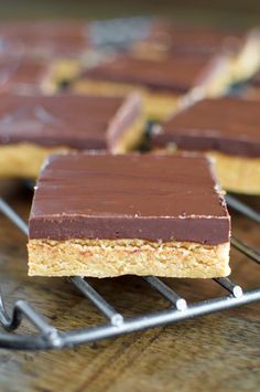 chocolate and peanut butter bars cooling on a rack