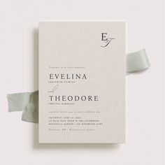 the wedding stationery is laid out on top of each other