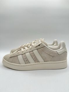 Elevate your sneaker game with these Adidas Men's Campus 00s Originals in size 12. The creamy off-white color and beige hue make them a versatile addition to any outfit. The style code IH9863 and model name Adidas Campus ensure you're on-trend and comfortable with every step. Perfect for men who value both athleticism and style, these sneakers are a must-have. The UK shoe size of 11.5 and US shoe size of 12 make them a great fit for most. Don't miss out on the chance to own these Adidas Campus sneakers, a classic addition to any sneaker collection. Campus Sneakers, Adidas Brand, Color Crema, Playing Basketball, Fit For Men, Athletic Gear, Adidas Campus, Sneaker Games, Stay Active