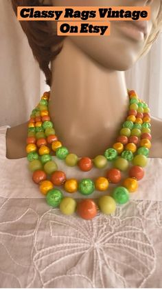 Will brighten any outfit from a T-shirt to a dress !
3 degraded strands of Lucite beads, yellow, orange and two shades of green. Golden hook clasp with extra beads for extension.
Classic 60's choker necklace.
Total length 15" to 18" Cheap Retro Beaded Necklaces, 70s Accessories Necklaces, Santa Fe Nm, Hook Clasp, May 11, Choker Necklaces, Yellow Orange, Shades Of Green, Santa Fe