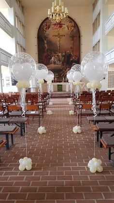 balloons are placed in the middle of an empty aisle