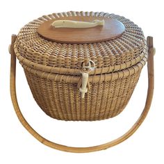 a wicker basket with a wooden lid and handle