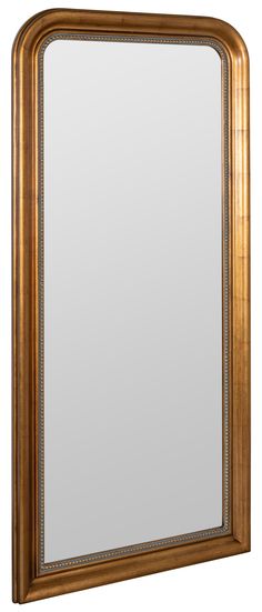 a large mirror sitting on top of a wooden frame