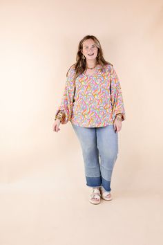 Get ready for spring with our adorable new "Follow Your Happiness" top! Featuring a charming notched v neckline, long sleeves, and a delightful pink, green, and yellow swirl print, this top is a must-have for the season. Pair it effortlessly with Judy Blue shorts and sandals for a fun and vibrant look that's sure to turn heads! Model: Kristen is wearing a size small. Abby is wearing a size large. Maci is wearing a size 2XL. Maci is wearing a size 2XL. Size Measurements: Small: Bust: 22 inches ac Spring Casual Flowy V-neck Top, Fun Multicolor V-neck Tops, Casual Flowy Tops With Split Neck, Flowy Casual Tops With Split Neck, Fun Long Sleeve Spring Tops, Flowy Split Neck Casual Tops, Multicolor Split Neck Top For Spring, Playful Relaxed Fit Top For Spring, Trendy Pink V-neck Top For Spring