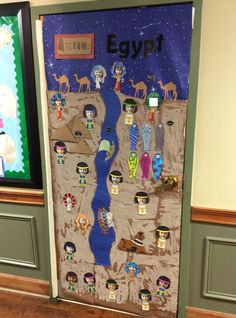 an egyptian themed door decorated with pictures and magnets for the pharaoh's trip to egypt