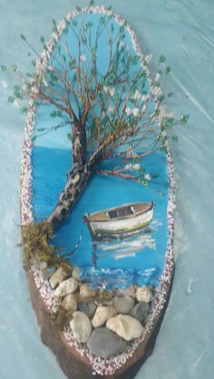 there is a small boat in the water and a tree with leaves on it,