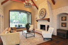 a living room with two couches and a fireplace