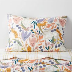 an image of a bed with flowers on the pillowcase and comforter cover set