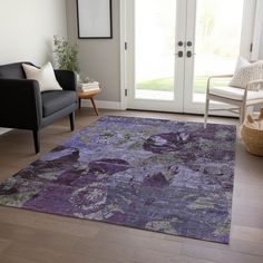 a living room with a purple rug on the floor