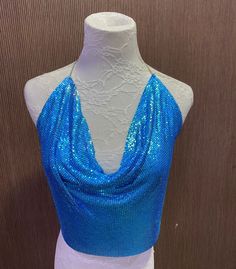 Beautiful chainmail top Gorgeous Blue colour  One size fits all - chain at back for sizing Blue Stretch Crop Top For Club, Sleeveless Blue Tops For Party Season, Blue Sleeveless Top For Party Season, Glamorous Blue Tops For Party Season, Embellished Halter Neck Tops For Party, Sequin Backless Party Top, Blue Sleeveless Halter Top For Evening, Sequin Backless Top For Party, Backless Sequin Party Top