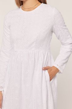 White eyelet temple dress with a round neck, keyhole back closure, long sleeves, with scalloped hem, hidden side zipper and side pockets. Self 100% Cotton, Lining 100% Polyester Hand wash in cold. Aprox. measurements in inches: XS:Length-55.5 |Bust-34 |Waist-28.5 S:Length-56 |Bust-36 |Waist-30 M:Length-56.5 |Bust-38 |Waist-32 L:Length-57 |Bust-40 |Waist-34 XL:Length-58.5 |Bust-44 |Waist-36 modest dresses, modest dress, modest midi, modest maxi, modest fashion, modest trendy dresses, modest bouti Long Sleeve Eyelet Dresses For Spring, Modest Long Sleeve Dress With Lace Trim, Broderie Anglaise Long Sleeve Day Dress, White Long Sleeve Dress With Back Zipper, White Long Sleeve Eyelet Dress, White Long Sleeve Dress With Cutwork Hem, White Long Sleeve Dress With Broderie Anglaise, Modest Attire, Skirts Modest