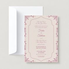 a pink and white wedding card with an ornate frame on the front, featuring a floral design