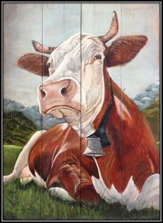 a painting of a brown and white cow laying down