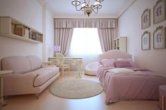 a living room with two couches, a bed and a desk in it stock photo