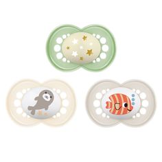 three pacifiers with animals on them and stars in the top one is green