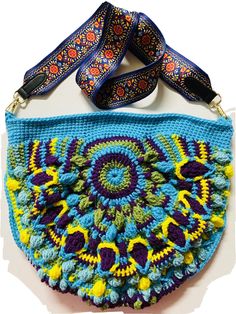 BRAND NEW,  TRULY UNIQUE,  ONE OF A KIND.  I am the only USA-based seller for these purses on Ebay! HANDMADE by me, crocheted with soft Red Heart acrylic yarn.!  Very BOHO colorful look!!  "Peacock Tail" PATTERN  used.  Very well made.  Peacock tone- turq blue, teal, yellow green- colors used. The back is just a circular motif.  Lined with quilting weight cotton fabric, very pretty blue and pink floral print.  There are no pockets inside.  The purse strap is very good quality, about 2" wide and about 39" long. Can be worn as both crossbody and shoulder bag. Very colorful strap! It took me about 20 hours to make this, following the pattern using a ton of textured stitches, then insert the sewn lining with a zipper.  The purse strap cost around $7, and zipper another $1, plus cost of yarn an Tail Pattern, Peacock Tail, Strap Purse, Teal Yellow, Soft Red, Pink Floral Print, Project Bag, Crochet Handmade, Crochet Bag Pattern