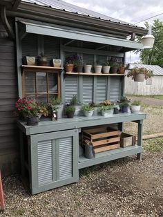 an outdoor potting shed with plants on the outside