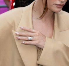 a close up of a person wearing a ring