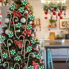 a christmas tree decorated with candy canes and ornaments in the shape of candies