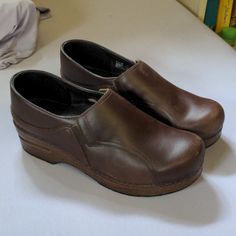 Very Lightly Worn With Tons Of Life Left. Brown Leather. Size 39 Brown Slip-on Clogs For Workwear, Brown Closed Toe Clogs For Work, Brown Round Toe Workwear Clogs, Leather Clogs With Reinforced Heel And Round Toe, Dansko Clogs, Dansko Shoes, Mule Clogs, Mules Shoes, Clogs