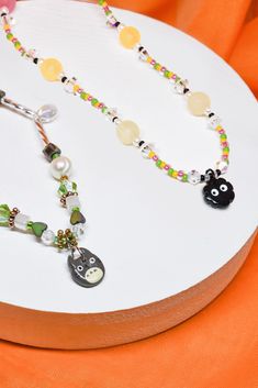 Handmade Totoro and Soot Sprite Charm Necklace! Each necklace is designed and made by me using a polymer clay charm, beads, etc.  Necklace length is approximately 14 1/2 inches long plus a 1 inch extender. Necklace is assembled with silver, nickel-free chain and findings. PLEASE NOTE:   -No two pieces will be exactly the same. Necklace may vary due to being handmade. -Necklace is handmade, therefore can be delicate. Gentle use is recommended. Soot Sprite, Soot Sprites, Charm Beads, Clay Necklace, Polymer Clay Charms, Clay Charms, Handmade Necklace, Necklace Length, Clay Crafts