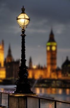 a street light with big ben in the background