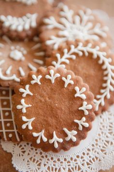 some cookies that are sitting on a doily