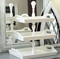 a white tray sitting on top of a table next to a mirror