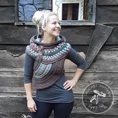 a woman standing in front of a wooden building wearing a cowgirl neck scarf and leggings