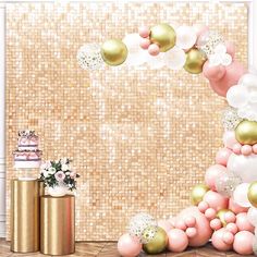 a pink and gold birthday party with balloons, confetti and cake on the table