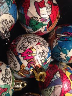 some very pretty decorated balls with cartoon characters on them, all in different colors and sizes