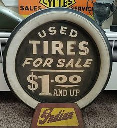 there is a sign that says used tires for sale $ 1 00 and up