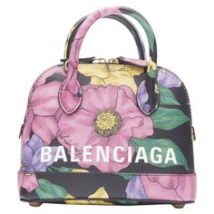 BALENCIAGA Ville XXS black floral logo print top handle crossbody bag Reference: TGAS/B01535 Brand: Balenciaga Designer: Demna Model: Ville XXS Material: Leather Color: Multicolour Pattern: Floral Closure: Zip Lining: Leather Extra Details: Ville XXS. Black base with floral print. Rolled top handle. Top zip closure. Detachable crossbody strap. Metal feet at base. Made in: Italy CONDITION: Condition: Unworn in mint condition, with tags. Comes with: Designer tags. One dust bag. MEASUREMENTS: Width Bag Reference, Leather Jewels, Floral Logo, Bowling Bags, Frame Bag, Balenciaga Designer, Chanel Black, Print Top, Bowling