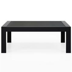 a black coffee table sitting on top of a white floor