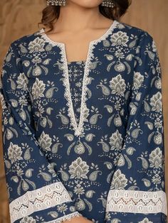 This 3-piece set includes blue cotton floral yoke print pakistani style, regular shape kurta has round neck, 3/4th sleeves, scalloped hem, calf length teamed with cotton printed trouser pants has elasticated waistband & slip on closure and a dupatta. The model wearing the size small is 5'8 in height. 3 Piece Set Color-Blue Kurta Fabric- Cotton Bottom Fabric - Cotton Dupatta Fabric-Voile Work - Floral Yoke Print detailing Neck - Round Neck Sleeves - 3/4th Sleeves Length-Calf Length Bottom - Print Luxury Cotton Salwar Kameez With Lace Work, Luxury Cotton Lawn Suit For Diwali, Luxury Paisley Print Kurta For Eid, Casual Cotton Kurta For Affordable Price, Luxury Long Sleeve Block Print Lawn Suit, Formal Red Lawn Suit With Printed Motifs, Red Formal Lawn Suit With Printed Motifs, Trouser Designs Pakistani, Lace Neck Design