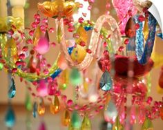 a chandelier with many colorful beads hanging from it