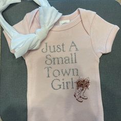 Just A Small Town Girl Baby Girl Onsie Country Themed Bow Not Included You Can Also Find This On My Etsy As Well For A Couple Dollars Cheaper Due To Poshmark’s Listing Charge Hayleycreationcrafts Baby Girl Cricut Ideas, Baby Onsies Ideas Girl, Terry Cloth Romper, Its A Girl Announcement, Just A Small Town Girl, Girls Leotards, Small Town Girl, Baby Boy Onesies