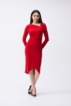 Drape yourself in elegance with this enchanting silky knit sheath dress. The unique wrap bottom injects a flirtatious twist to this classic silhouette, while the asymmetrical neckline, adorned with shirring and a golden ornament, exudes an air of sophistication. Additional shirring gracefully traces your waist and hip to enhance your curves and complete the piece’s refined appeal.Brand: Joseph RibkoffStyle: 243169Color: Lipstick RedFabric: Silky knit fabricComposition: 95% Polyester, 5% SpandexD Elegant Asymmetrical Hem Bodycon Cocktail Dress, Elegant Fitted Bodycon Dress With Asymmetrical Hem, Elegant Bodycon Dress With Asymmetrical Hem, Elegant Formal Bodycon Dress With Asymmetrical Hem, Elegant Stretch Asymmetrical Cocktail Dress, Elegant Ruched Bodycon Dress With Asymmetrical Hem, Fitted Asymmetrical Sheath Dress For Evening, Elegant Bodycon Asymmetrical Dress, Elegant Asymmetrical Hem Stretch Dress