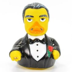 a yellow rubber duck wearing a tuxedo and bow tie with a rose in his lapel