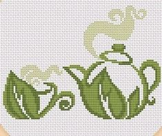 a cross stitch pattern with green flowers on it