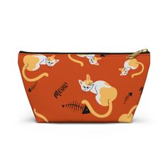 an orange zipper bag with cats and fish on it