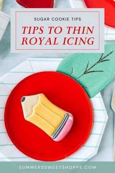 sugar cookie tips for royal icing on a red plate with forks and spoons